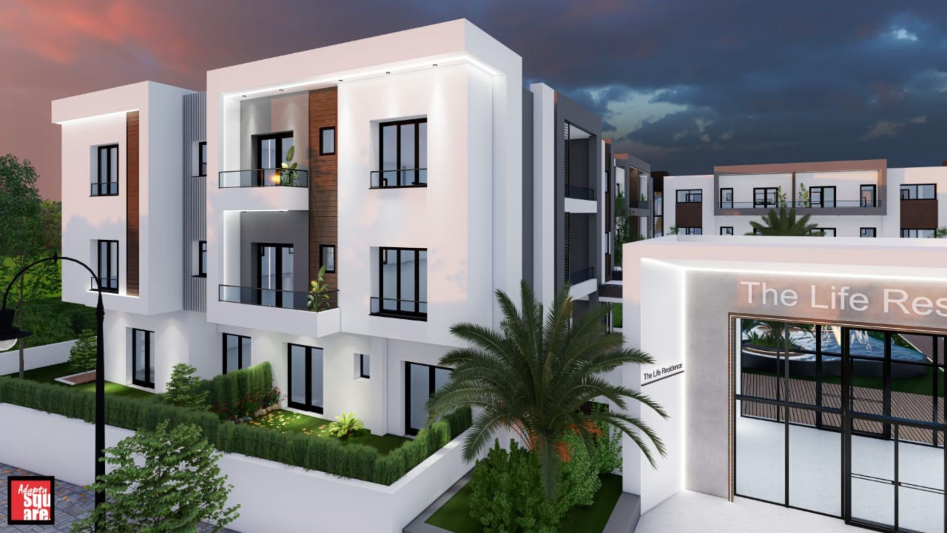 Vue nocturne du complexe avec éclairage architectural